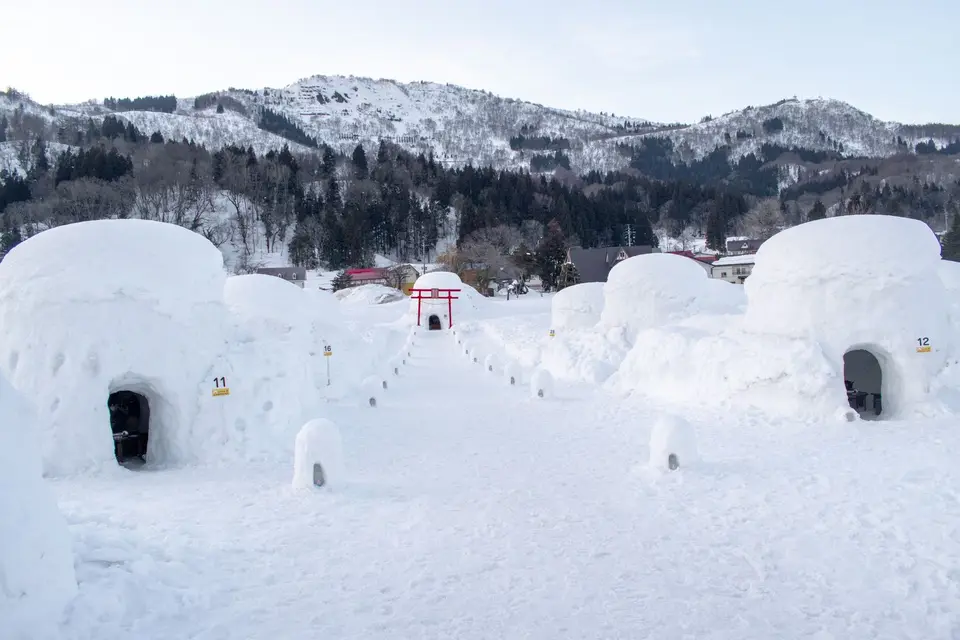 Kamakura snow huts in a snowy field in Nagano