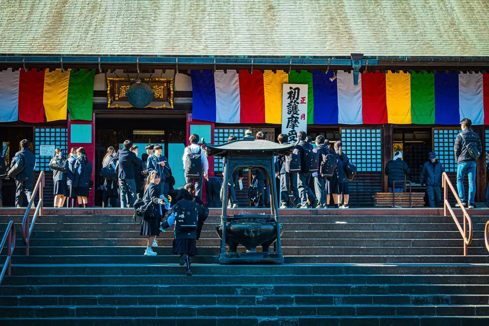 Visitors at a colourful temple hall in Kawagoe, Saitama