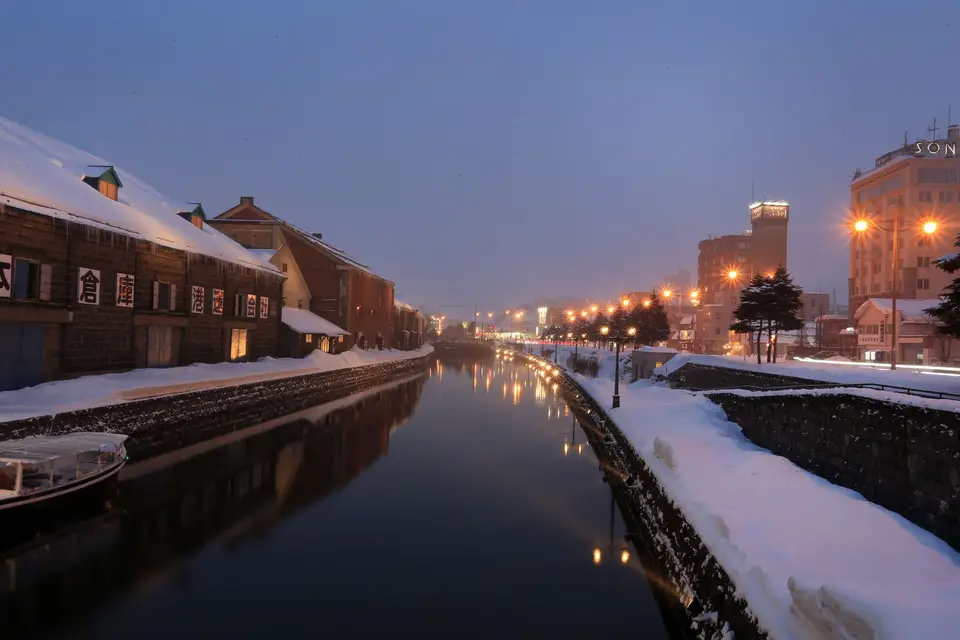 Otaru Canal and its old stone warehouses on a snowy evening