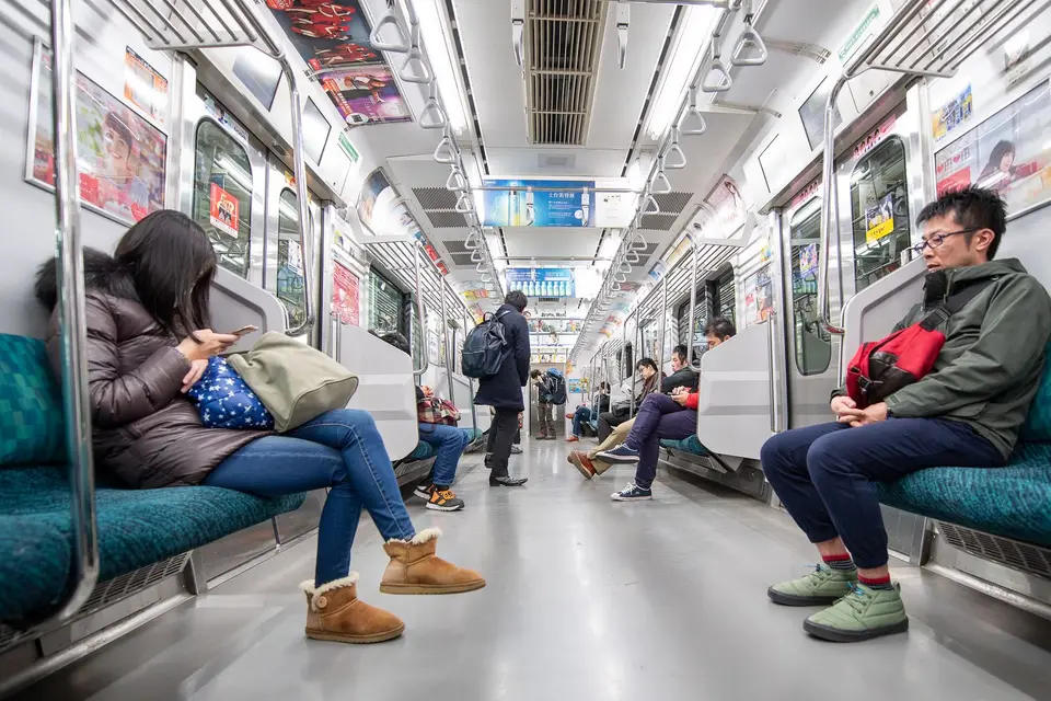 Passengers sitting quietly on a Tokyo subway train